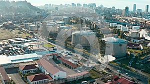 Aerial view of oil and gas steel storage tanks of oil and LPG petrochemical. Oil tank farm for gas, diesel and petroleum