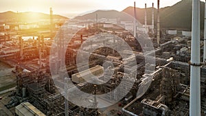 Aerial view oil and gas tank with oil refinery background at night, Business petrochemical industrial, Refinery factory oil