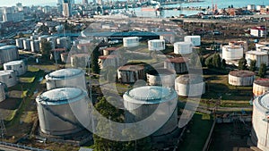 Aerial view of oil and gas terminal with steel storage tanks of oil and LPG petrochemical. Oil tank farm for gas, diesel