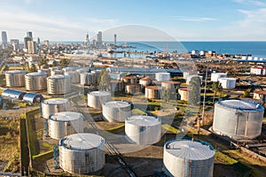 Aerial view of oil and gas terminal with steel storage tanks of oil and LPG petrochemical. Oil tank farm for gas, diesel