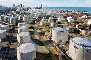 Aerial view of oil and gas terminal with steel storage tanks of oil and LPG petrochemical. Oil tank farm for gas, diesel