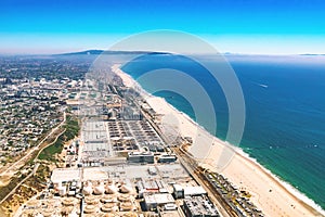 Aerial view of an oil refinery on the beach of LA