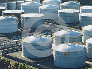 Aerial view of Oil Refinery Industrial Site and White Holding Container Tanks