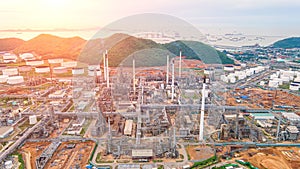 Aerial view Oil refinery.Industrial view at oil refinery plant form industry zone with sunrise and cloudy sky.Oil refinery and