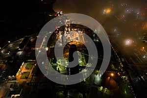 Aerial view of oil refinery. Plant with lots of light at night.