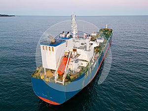 Aerial view oil ship tanker carrier oil on the sea at sunset