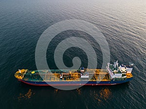 Aerial view oil ship tanker carrier oil on the sea at sunset