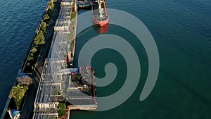 Aerial view oil ship tanker vessel loading in gas and oil terminal station refinery, Global trading import export