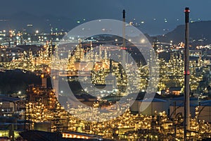 Aerial view oil storage tank with oil refinery background, Oil refinery plant at night