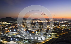 Aerial view oil storage tank with oil refinery factory industrial. Oil refinery plant at night. industry factory concept and