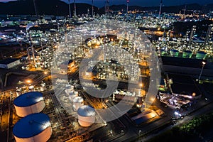 Aerial view oil storage tank with oil refinery factory industrial. Oil refinery plant at night. industry factory concept and