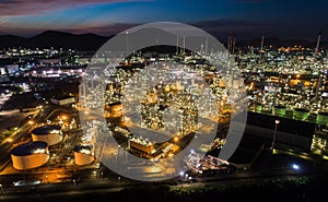 Aerial view oil storage tank with oil refinery factory industrial. Oil refinery plant at night. industry factory concept and