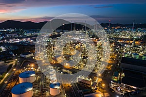 Aerial view oil storage tank with oil refinery factory industrial. Oil refinery plant at night. industry factory concept and