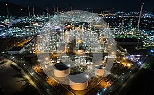 Aerial view oil storage tank with oil refinery factory industrial. Oil refinery plant at night. industry factory concept and