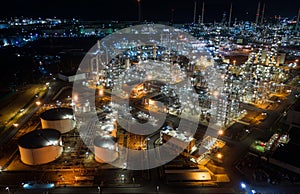 Aerial view oil storage tank with oil refinery factory industrial. Oil refinery plant at night. industry factory concept and