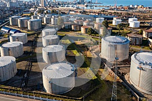 Aerial view of oil tanks at oil refinery. Gas and oil steel storage containers. Tank farm storage chemical petroleum