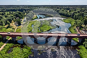 Aerial view of an old bridge across the Venta river in Kuldiga, Latvia