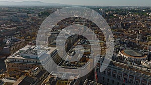 Aerial view of old buildings in historic urban borough. Forwards fly above Palazzo Montecitorio, Italian parliament