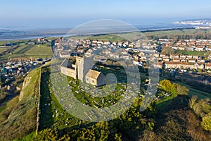 Aerial view of the old church of St Nicholas at Uphill and boatyard near Weston Super Mare, UK