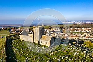 Aerial view of the old church of St Nicholas at Uphill near Weston Super Mare, UK