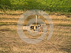 Aerial view of a old combine harvester at the grain harvest