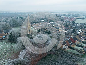 Aerial view of an old English church seen during a wintery December