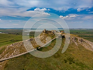 Aerial view of the old Enisala stronghold citadel standing on the hill in the sunset