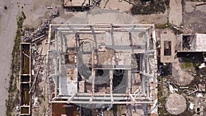 Aerial view of an old factory ruin. Old industrial building for demolition. Pull up shoot.