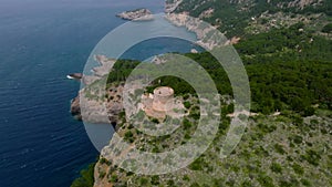 Aerial view of the old fort tower on the cliff on the island of Mallorca.