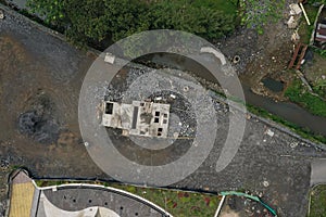 Aerial view of an old, half destroyed concrete building in a poor neighbourhood