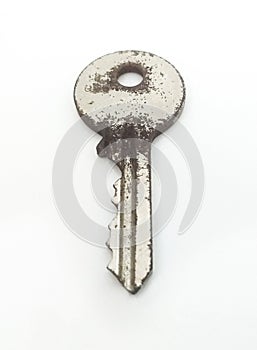 Aerial view of Old and rusty round key in vertical position.Close up