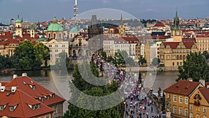 Aerial view of the Old Town architecture and Charles Bridge over Vltava river day to night timelapse in Praha