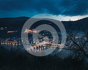 Aerial view of Old Town at night with Heidelberg Castle and Old Bridge (Alte Brucke) - Heidelberg, Germany