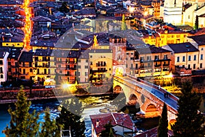 Aerial view of the old town Verona, Italy. Illuminated bridge with other landmarks