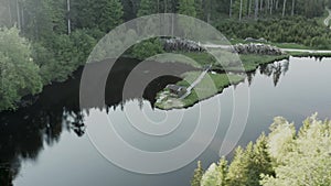 Aerial view of old wooden fisherman house on the lake.