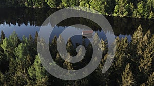 Aerial view of old wooden fisherman house on the lake.