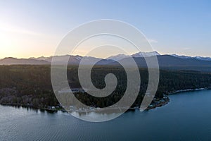 Aerial view of the Olympic Mountains and the Puget Sound at sunset from Potlatch, Washington in March 2023