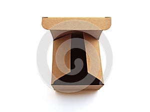 Aerial view of open brown recycled cardboard box isolated. Close up of lid and square organic box on white background.