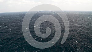 Aerial view of Open ocean waters, gale force winds and whitecaps at winter