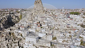 Aerial view of Ortahisar town old houses in rock formations.