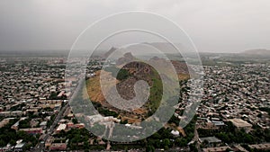 Aerial view of Osh city, Sacred Mountain Sulaiman Too in city centre. Beautiful powerful mountain