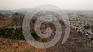 Aerial view of Osh city, Sacred Mountain Sulaiman Too in city centre. Beautiful powerful mountain