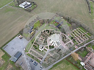 Aerial view of Osterlars Kirke church building surrounded by trees and farmland photo
