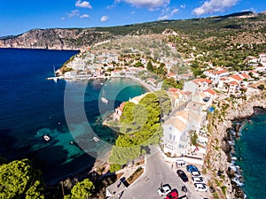 Aerial view over Assos Kefalonia beach with clear blue waters an