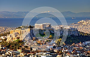 Aerial view over Athens with te Acropolis and harbour from Lycabettus hill, Greece at sunrise