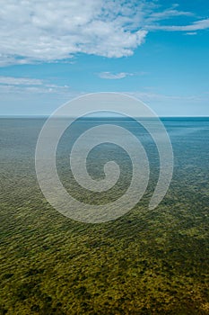 Aerial view over the Baltic sea from the Panga cliff in Saaremaa, Estonia during sunny day. the highest bedrock outcrop in western