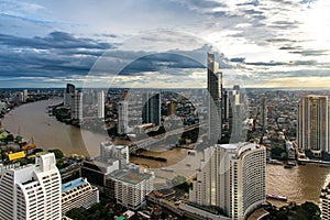 Aerial view over Bangkok modern office building in bangkok business zone near the river with sunset sky in Bangkok,