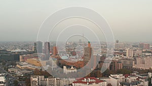 AERIAL: View over Berlin, Germany Cityscape with Alexanderplatz TV Tower and Potsdammer Platz in Beautiful Orange Autumn