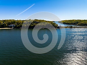 Aerial view over the calm waters in Oyster Bay near Lloyd Harbor, New York on a sunny day