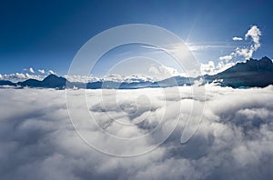 Aerial view over cloud bank to tirol mountain alps